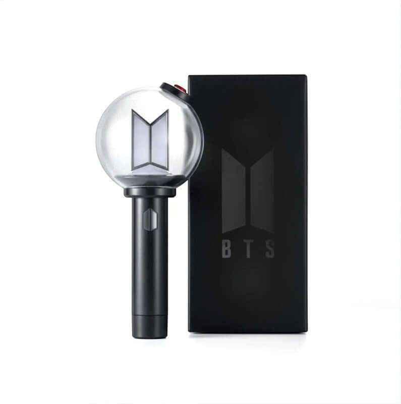 BTS ARMY Bomb Ver.4 official K-pop lightstick, a clear globe with the BTS logo on a black handle, next to its retail box
